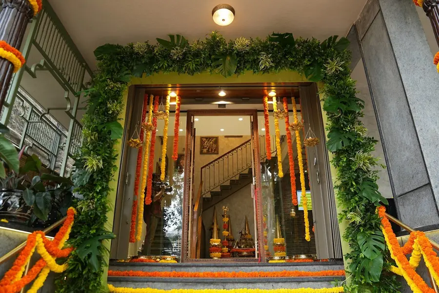 The entrance hung with marigold and mango leaf festoons.