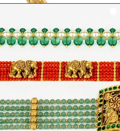 Rows of green beads and coral with carved gold panels.